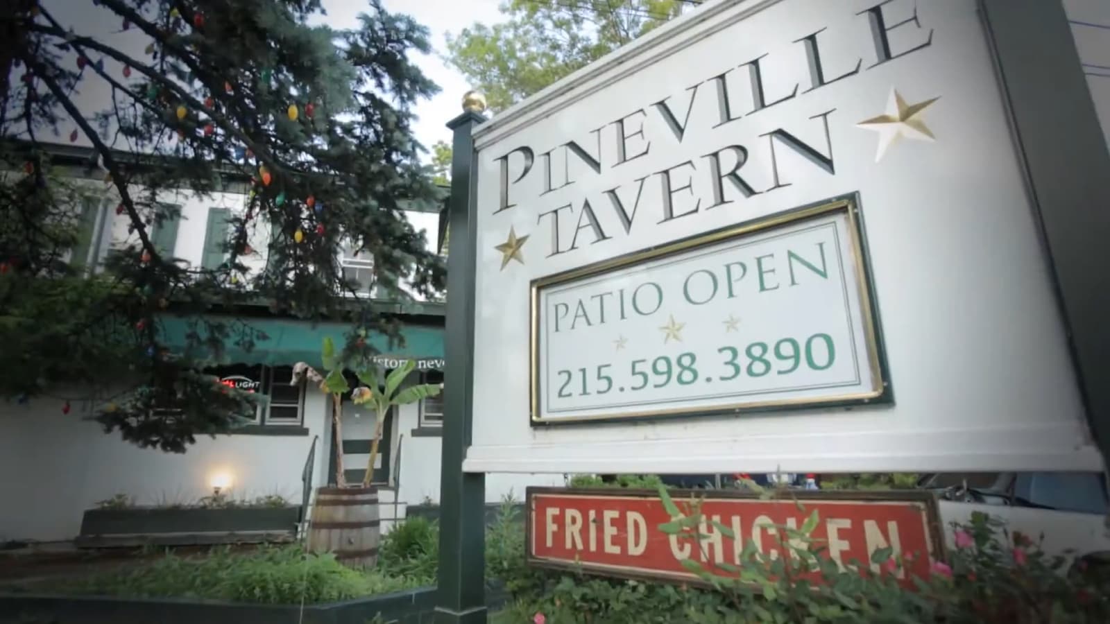 The quaint Pineville Tavern signboard with contact details and specials