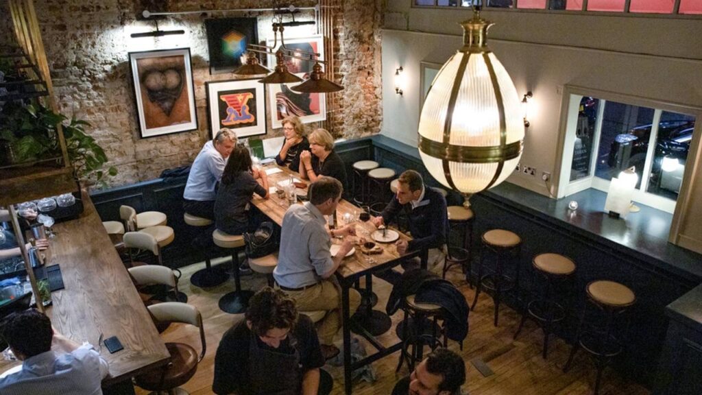 People eating at tables in an establishment, top view