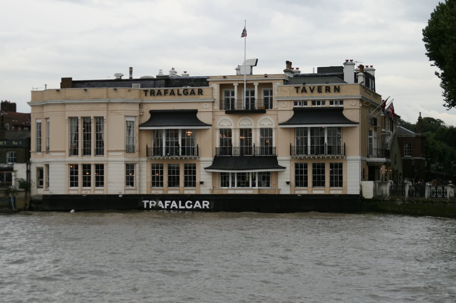 Tavern on the shore of a body of water with canopies